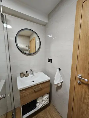 a bathroom with a sink and a mirror at Apartman Marin in Livno