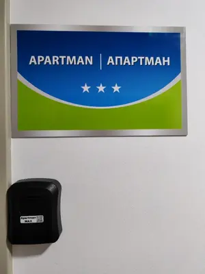 a sign on the door of an airplane at Apartman Max in Modriča