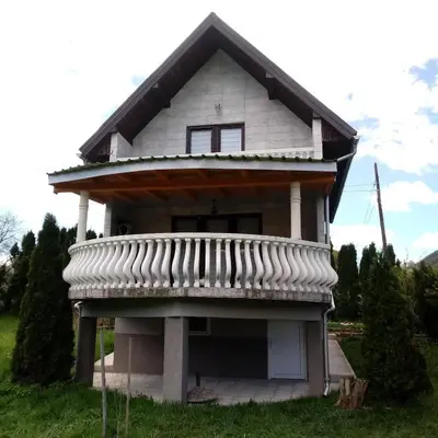 a small house with a balcony on top of it at Vikendica M&M / Vacation home M&M in Visoko