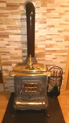 a stove is sitting on a table in a room at Vikendica M&M / Vacation home M&M in Visoko