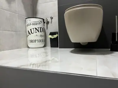 a bathroom with a urinal and a toilet in a room at Apartman Ena Fojnica in Fojnica