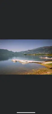 a body of water with a group of boats in it at Auto Camping Grubeša in Dronjići