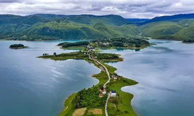 an island in the middle of a large body of water at Auto Camping Grubeša in Dronjići