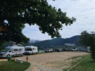 a group of vehicles parked in a parking lot at Auto Camping Grubeša in Dronjići