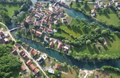 an aerial view of a group of houses next to a river at Villa Pliva Oasis in Jezero