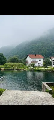 a view of a lake with houses in the background at Villa Pliva Oasis in Jezero