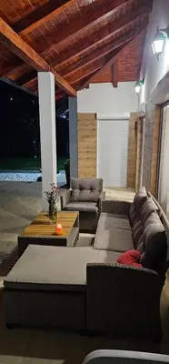 a living room with couches and a table at Villa Park Banja Luka in Banja Luka