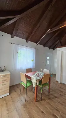 a dining room table and chairs in a room at Villa Park Banja Luka in Banja Luka