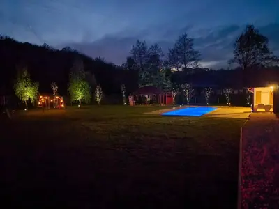 a view of a yard at night at Villa Park Banja Luka in Banja Luka