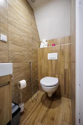 a bathroom with a toilet and a sink at Resort La Familia in Bihać