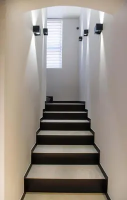 a staircase with lights on the wall at Hotel Nacional in Bosanska Gradiška