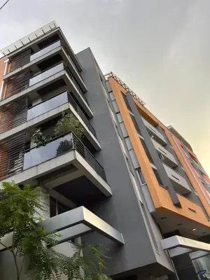a building with a balcony with a plant on it at Amsterdam in Banja Luka