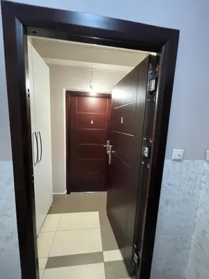 a door leading into a room with a hallway with a tile floor at Amsterdam in Banja Luka