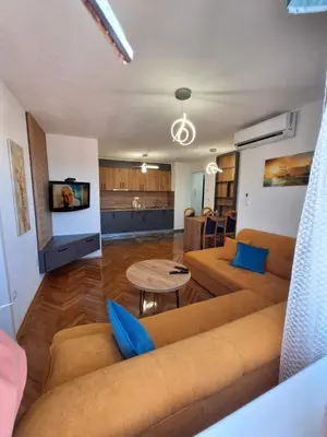 a living room with a couch and a table at centar apartment in Banja Luka