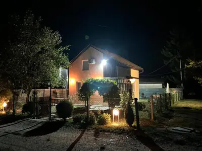 a house at night with lights in the yard at VillaH Weekend House in Visoko