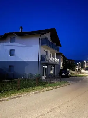 a white house on the side of a street at Pišta-pause in Bihać