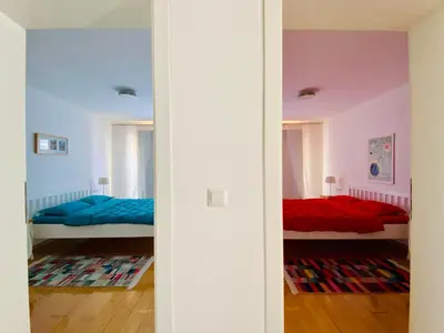 two beds in a room with two beds at Moon Apartment Bihac in Bihać