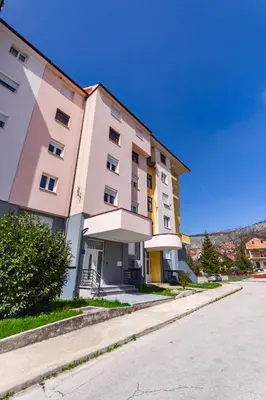 a large building on the side of a street at Apartman Krželj B2 in Livno