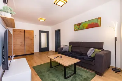 a living room with a couch and a coffee table at Apartman Krželj B2 in Livno