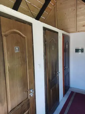 two doors in a room next to each other at AutoCamp Aqualand in Bihać