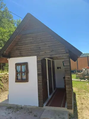 a small dog house with a door and a window at AutoCamp Aqualand in Bihać