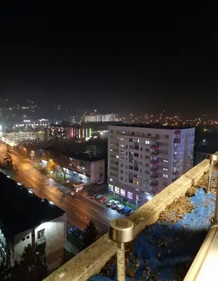 a view of a city at night with lights at Luxury Apartment Tuzla in Tuzla