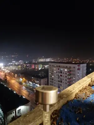 a view of a city at night at Luxury Apartment Tuzla in Tuzla