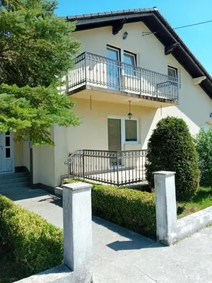 a house with a balcony on top of it at Perisa in Livno