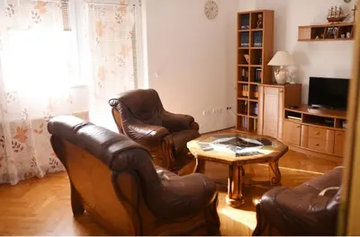 a living room with leather chairs and a coffee table at Perisa in Livno