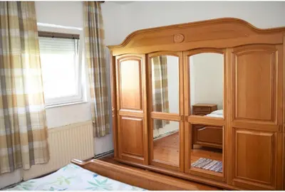 a wooden cabinet in a room with a window at Perisa in Livno