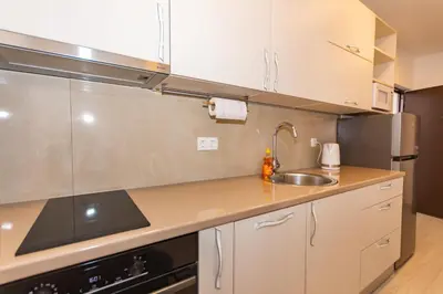 a kitchen with a sink and a counter top at Apartman Krželj B3 in Livno
