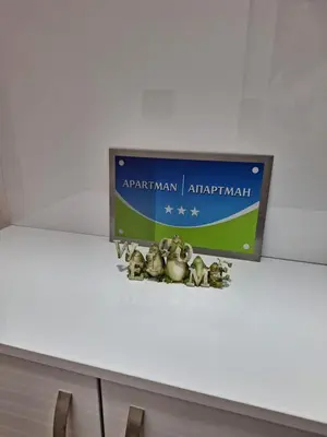 a sign sitting on top of a table at Apartman Una banjaluka in Hiseti