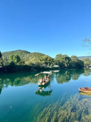 a group of people in a boat on a lake at Unavis Residence in Bihać