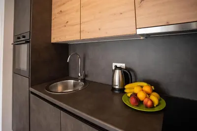 a plate of fruit on a counter in a kitchen at Apartman Krželj B1 in Livno