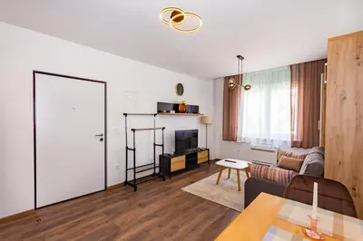 a living room with a couch and a table at Apartman Krželj B1 in Livno