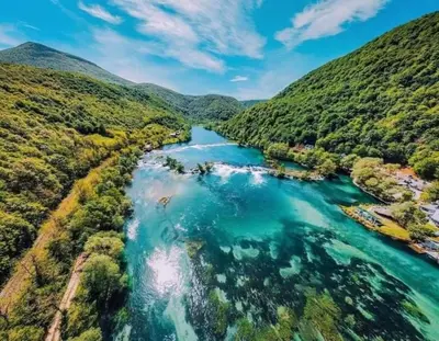 an aerial view of a river in a valley at Pure Nature in Bihać
