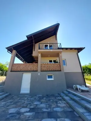 a house with a balcony on the side of it at Vikendica Villa Ramona Banja Luka in Banja Luka