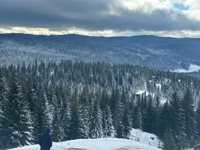 a man standing on top of a snow covered mountain at Farmhouse Dženi in Vlasic