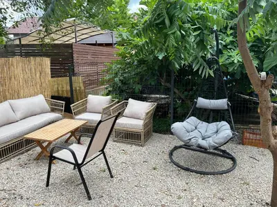 a patio with two chairs and a couch and a table at Una in Bihać