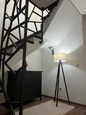 a room with a ladder and a lamp and a dresser at Una in Bihać