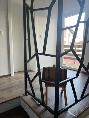 a chair in a room with a window at Una in Bihać