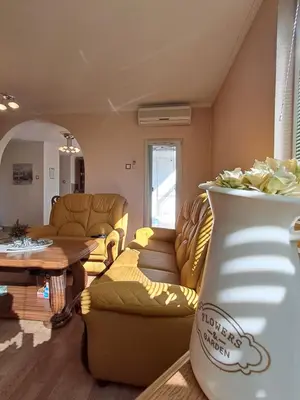 a living room with a couch and a table at Apartman Ajla in Bihać