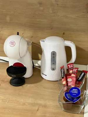 a coffee maker and a toaster on a table at ANET Apartman Visoko in Visoko