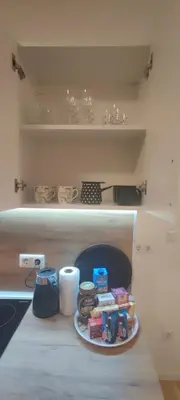 a plate of food on a shelf in a kitchen at Apartmani Sarah 4 Tuzla in Tuzla