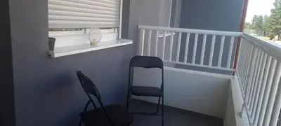 a stair case with a chair and a window at Ivan in Livno