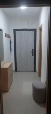 a room with a door with a stool and a drawer at Ivan in Livno