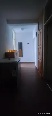 an empty room with a hallway with a white wall at Apartman Dijana in Livno
