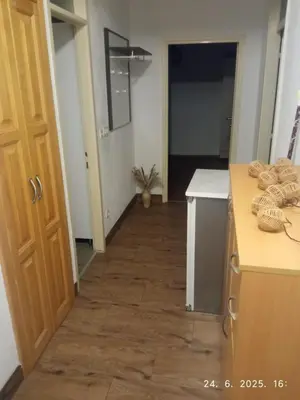 a kitchen with a counter and a hallway at Apartman Dijana in Livno