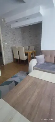 a living room with a couch and a table at Apartman Dijana in Livno