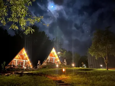 a house at night with the lights on at Vikendica - Rajski Poluotok in Jajce